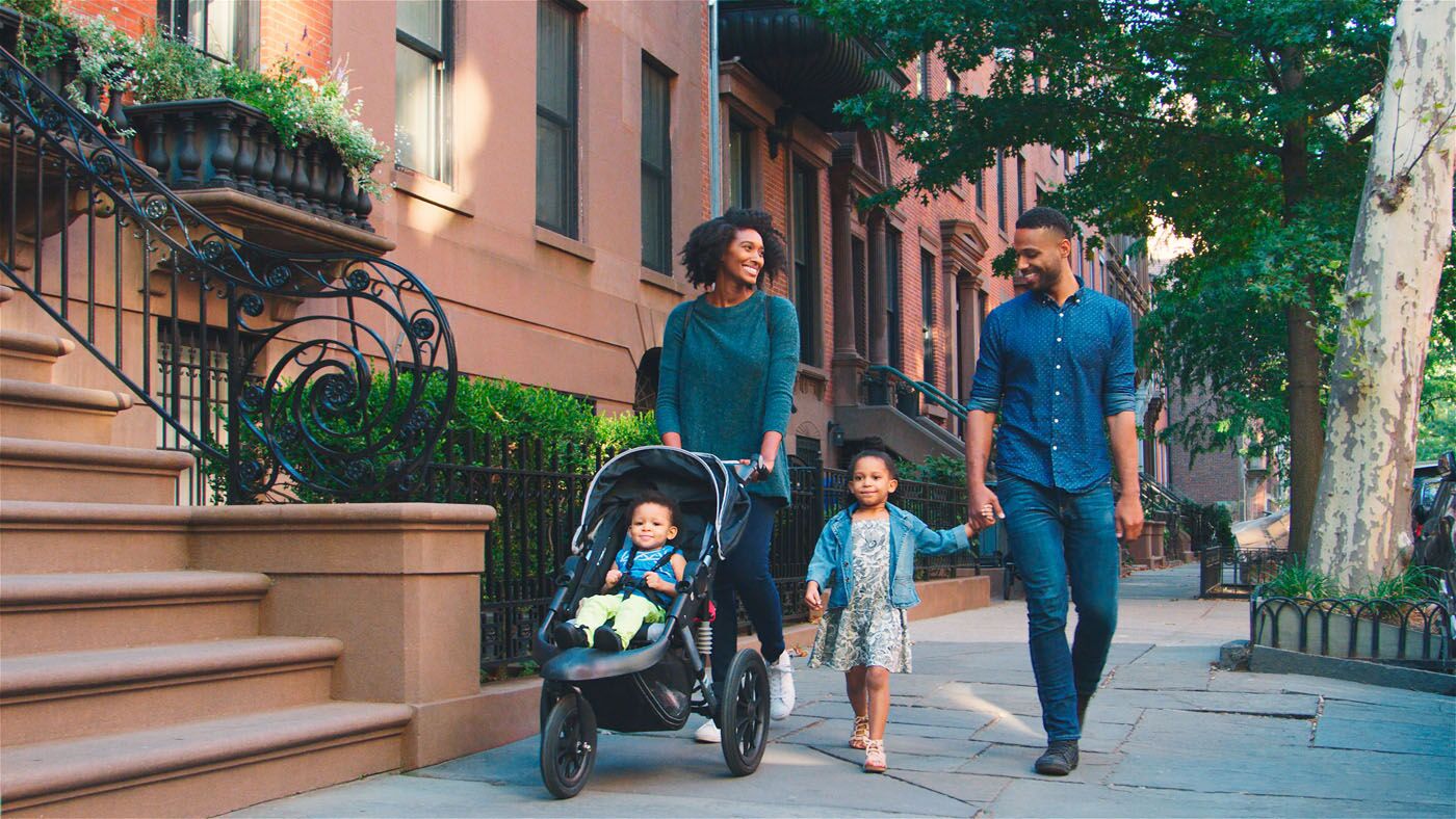 An image of a family walking down a city street - Rest Easy Pest Control offers expert pest control services in Queens, NY to protect your home or business.